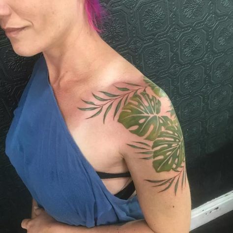 Monstera Plant Tattoo Shoulder, Green Plants Tattoo, Fern Tattoo Color, Monstera Hand Tattoo, Leaf Stomach Tattoo, Monstera Arm Tattoo, Tropical Vine Tattoo, Monstera Shoulder Tattoo, Shoulder Plant Tattoo