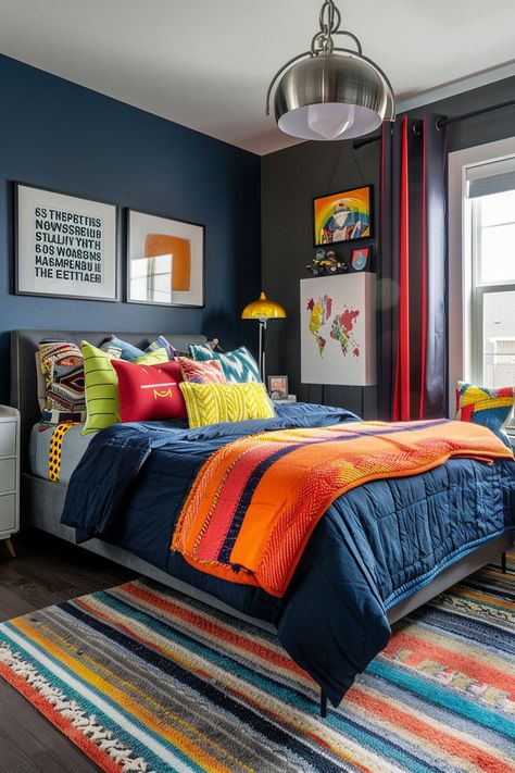 Looking for teen boy bedroom ideas? Create a space that reflects his personality with these awesome decor ideas. From sports-themed designs to modern minimalism, there are plenty of options to choose from. Use colors like navy, gray, and black to create a cool and stylish atmosphere. #teenboybedroom #bedroomdecor #boysroomideas Black And Blue Boys Room, Kid Boy Bedroom Ideas, Blue And Orange Boys Room, Boy Bedroom Colors, Rhys Bed, Room Ideas For Teen Boys, Sport Room Ideas, Blue Bed Ideas, Teen Bedroom Paint Ideas