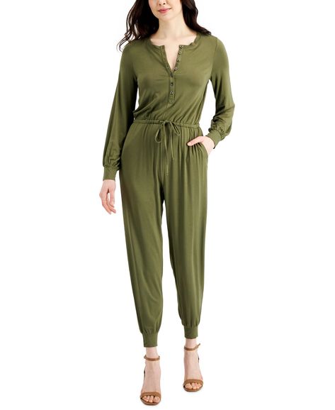 Soft and comfy knit gives a snug allover hug, then buttons up with faux-shell buttons, cinches at the waist and tapers at the jogger legs of this Style & Co jumpsuit. Approx. model measurements: height: 5'10"; bust: 31-1/2"; waist: 24"; hips: 35" Approx. inseam: 28" Round neckline; button front closures Cinched tie waistline; cuffed jogger legs Side front pockets Cuffed long sleeves Rayon/spandex Machine washable Imported Web ID: 13518244