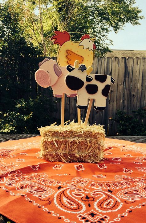 Centerpiece Idea for Picnic Table - use small haybale with wooden animals at ACMoore (horse, pig, cow?) - attach to wooden dowels 1 Yr Birthday, Old Macdonald Birthday, Mcdonalds Birthday Party, Barnyard Theme, Old Macdonald Had A Farm, Farm Themed Party, Barnyard Birthday Party, Farm Theme Birthday, Farm Animal Party