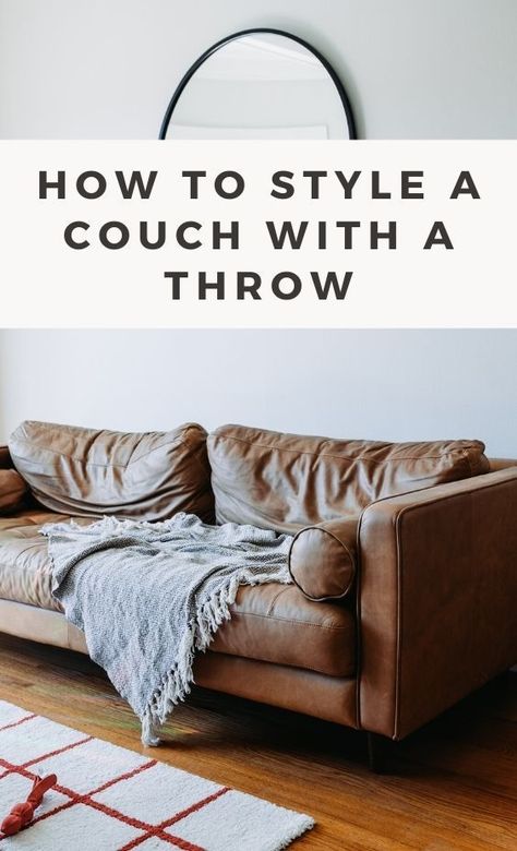 Learn how to style your couch with a throw to add color, texture, and coziness to your living space. This guide provides tips and ideas for creating the perfect look with arrangement and layout ideas. Blankets On Couch Ideas, Style A Couch, House Staging, Cheap Organization, Chill Style, Couch Throw Blanket, Blue Couches, Black Throws, Cozy Living Spaces