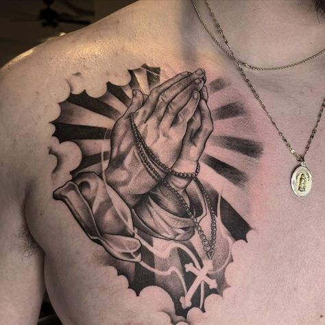 If you have been looking for unusual tattoo designs with praying hands for a long time, then our article is for you. We have collected 55+ of the most interesting and their meanings in human life. Praying Hands With Sun Rays Tattoo, Praying Hands Chest Tattoo, Prayer Hands Tattoo, Neck Tattoo Women, Praying Hands Tattoo Design, Prayer Tattoo, Tattoo On Chest, Rose Tattoo Stencil, Praying Hands Tattoo