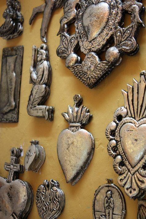 Mexican devotional decor: Mexican milagros Mexican Milagros, Silver Wall Art, Silver Wall, Southwest Decor, Mexican Decor, Tin Art, Beating Heart, Religious Icons, Arte Popular