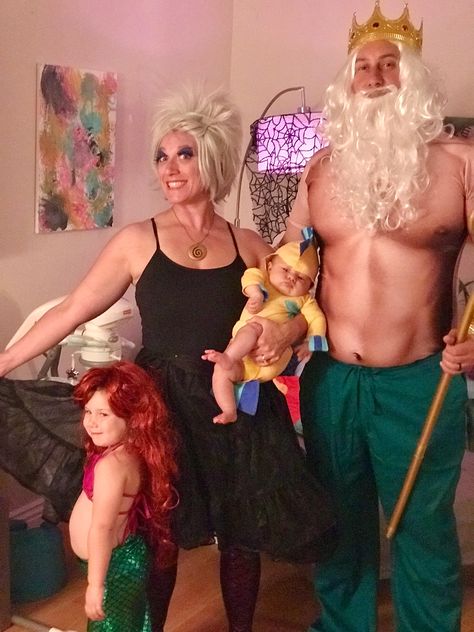 Little Mermaid costumes. King Triton, Ursula, Flounder and of course, Ariel. Triton: separate items purchased on Amazon, hand painted trident Ursula: separate Amazon items and hand pained necklace Ariel: purchased from Amazon Flounder: home sewn King Trident Costume, King Triton Costume Diy, Triton Costume, King Triton Costume, Flounder Costume, King Triton, Funny Couple Costumes, Mermaid Costumes, Mermaid Halloween Costumes