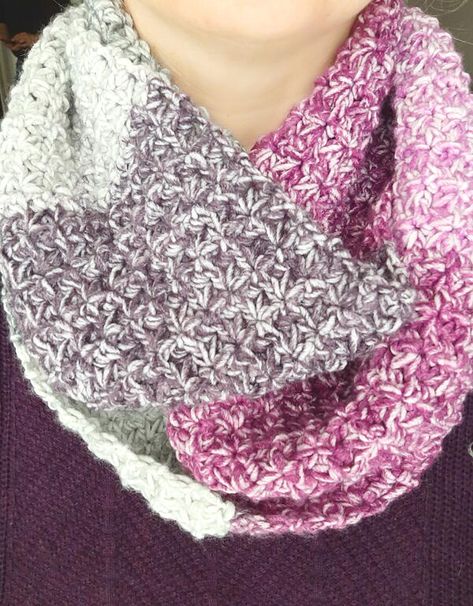 This free infinity scarf crochet pattern has so many great things about it. Not only is it a beautiful addition to your crochet accessories, but it is a quick and easy crochet project. Plus, it only takes one skein of Lion Brand Mandala Ombre yarn! The Trinity Infinity Scarf crochet pattern is made using the Trinity Stitch which is a fairly opaque stitch with minimal holes. This makes this scarf nice and cozy and warm for those chilly days. This scarf is such a fun project to complete. It is a s Infinity Scarf Crochet Pattern, Shawl In A Ball, Trinity Stitch, Lion Brand Mandala Yarn, Infinity Scarf Crochet, Crochet Infinity Scarf Pattern, One Skein Crochet, Super Scarf, Infinity Scarf Pattern