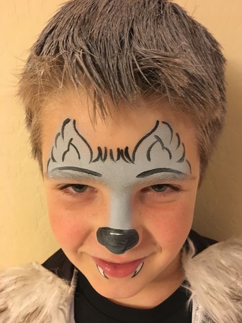 Wolf face painting Werewolf Face Paint, Kids Face Painting Easy, Wolf Face Paint, Face Painting Halloween Kids, Dog Face Paints, Easy Halloween Face Painting, Easy Face Painting Designs, Maquillage Halloween Simple, Halloween Makeup For Kids