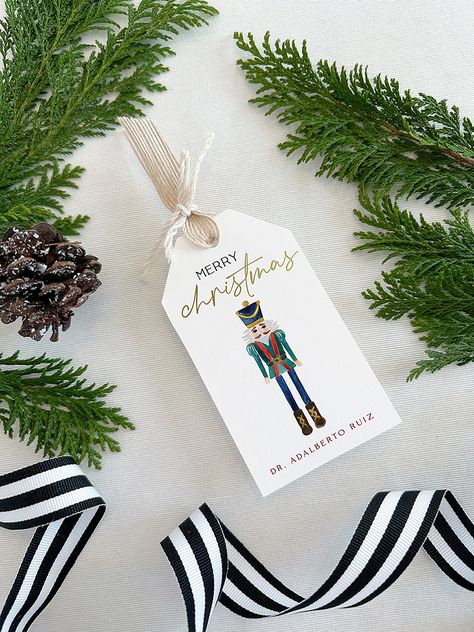 "▪ DESCRIPTION ▪ Dress up every Christmas gift that leaves your hands with these personalized Nutcracker gift tags! You can also use them as favor tags. You can buy them as an addition to your own desk, or as the perfect Christmas personalized gift for someone special. * Set of 12 2.5\" x 4.5\" gift tags. * Paper: fine 120# eggshell. Felt paper upgrade is available on our website. * Printing method: digitally printed with foil-pressed details. Foil-pressed name upgrade is available on our websit Xmas Prints, Personalized Christmas Tags, Christmas Name Tags, Custom Hang Tags, Christmas Gift Tags Personalized, Stocking Tags, Linen Ribbon, Christmas Stationery, Christmas Favors