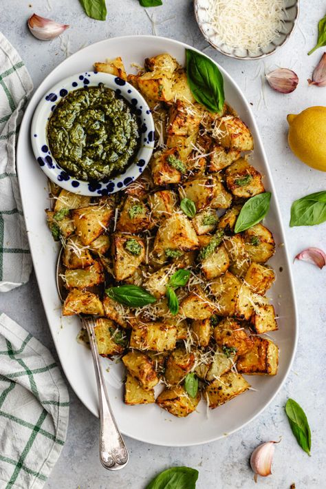 Pesto roasted potatoes on a serving platter topped with pesto and parmesan. Mediterranean Tomato, Crispy Veggies, Soup And Salad Combo, Tomato And Cucumber Salad, Tomato And Cucumber, Pesto Potatoes, Vegan Feta Cheese, Greek Potatoes, Vegan Parmesan Cheese