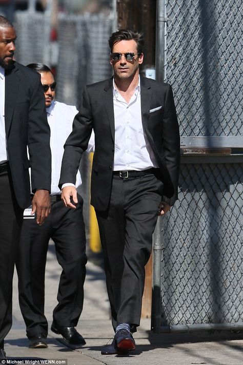 Jon Hamm cuts a dapper figure in open-wide shirt for Jimmy Kimmel Live #dailymail Black Suit No Tie Men, Mens Suit No Tie, Suit And Sunglasses Men, No Tie Suit Style, Black Suit Without Tie, Suit And Tie Aesthetic Men, No Tie Suit, Black Suit No Tie, Suit No Tie