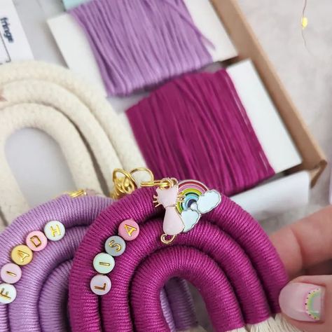 Ashfield Macramé | Vicky 👋 on Instagram: "Would you like to learn how to make these? Why not order a DIY kit! 🌈  Our kits include all the materials you need to make 2 rainbow bag charms, complete with enamel charms and letter beads. The kits also include photo instructions and a pattern card :)  Order yours from www.ashfieldmacrame.com  I was actually supposed to fly to Florence to visit my friend @heresthelodown for the weekend. But I've been hit with the worst cold I've ever had. A cold or the flu, I actually don't know 🥲 Not the weekend I was hoping for, but sure, what can you do.  Vicky xx  www.ashfieldmacrame.com  #diy #diykit #macramerainbow #rainbowmacrame #doityourself #artsandcrafts #crafty #craftyqueen #macrame #tutorial #behindthescenes #processvideo #howto" Rainbow Macrame, Rainbow Bag, Diy Rainbow, Bag Charms, Macrame Tutorial, Macrame Projects, Macrame Design, Card Patterns, Letter Beads