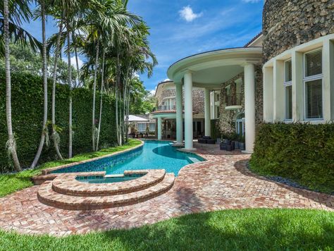 A tile-lined pool with a brick patio borders one side of this Charles Pawley designed property in Miami that embraces its original 1923 architecture. Pool With Brick, Pool With Palm Trees, Beach House Pool, Chicago Brick, Geometric Pool, Brick Patio, Storage Inspiration, Brick Pavers, Underwater Lights