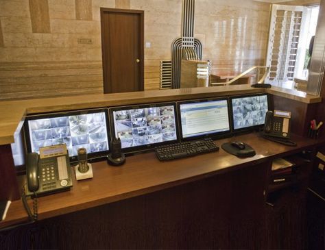 Multiple monitor displays behind concierge desk - Security Cameras, Email, Internet, etc... Security Desk Design, Lobby Security Desk, Security Office Design, 80s Nightclub, School Lobby, Concierge Desk, Office Security, Security Office, Home Alarm System