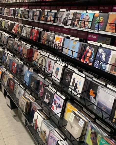 many different albums of music on a wall on shelves/racks in the shop HMV some include Freddie Mercury, Melanie Martinez and Arctic Monkies Cd Collection Aesthetic, Cds Aesthetic, Cd Store, Cd Aesthetic, Physical Media, John Mayall, Record Stores, Cd Music