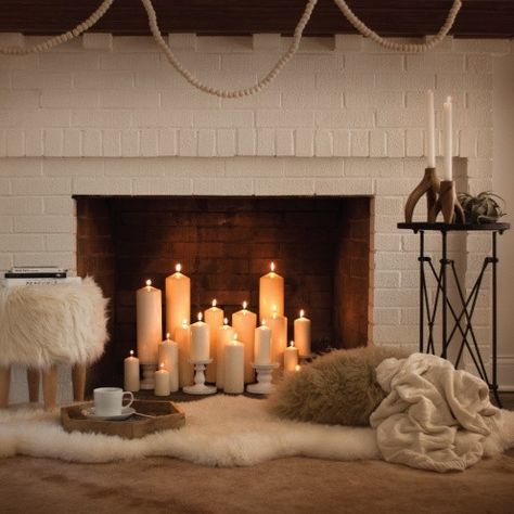 Making Over an Out-of-Order – or Out of Season – Fireplace - Hayneedle Empty Fireplace Ideas, Unused Fireplace, Fireplace Candle Holder, Candles In Fireplace, Farmhouse Fireplace, Ideas For Decorating, Faux Fireplace, Candle Room, Diy Fireplace