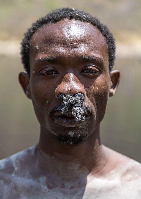 https://flic.kr/p/T5SnLu | Borana tribe man with protection in his nose ready to dive in the volcano crater to collect salt, Oromia, El Sod, Ethiopia | © Eric Lafforgue www.ericlafforgue.com Borana Tribe, Africa History, Oromo People, Tribes Man, 35mm Film Photography, Eric Lafforgue, Film Photography 35mm, Underwater Photos, Film Wedding Photography