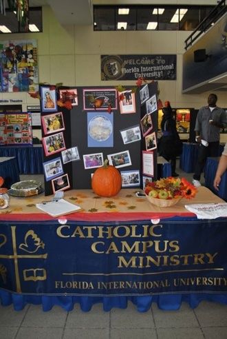 A display table promotes participation in Catholic Campus Ministry club at FIU's Biscayne Bay campus. Campus Ministry, Florida International University, Display Table, Table Display, Display Board, College Life, About Us, Miami