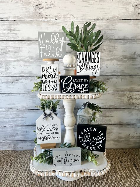 Beautiful collection of inspirational and faith based mini signs ! Featuring a neutral color palette of grey, black, and white, these signs will easily mix into you existing decor.  This set of seven signs can be purchased individually or as a set. You will only receive the set of sever signs if you select ENTIRE SET from the drop down menu. Tray and personal decor is NOT included.  Sizes of signs, in inches , are as follows: Walk by faith-4.5x4.5 Pray more, Worry Less- 4x2.5 Prayer changes everything-3.4x3.5 Saved by Grace-4x2.5 wood house-4x6 Faith it til you make it-4.5x4.5 Not perfect just forgiven-4x2.5 TRAY IS NOT INCLUDED. All items are handmade by me in my home. Thank you for supporting a mama owned business :) Tired Trays, Diy Tray Decor, Posters Diy, Pray More, Scripture Decor, Bible Verse Wall Decor, Inspirational Decor, Tier Trays, Mini Signs