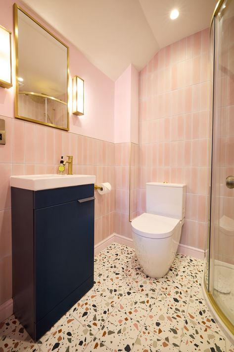 A navy vanity unit and a terrazzo tiled floor add a punch to this pretty en suite shower room by AMC Design. Photography by David Lindsay Navy And Pink Bathroom, Pink And Navy Bathroom, Pink Ensuite, Pink And White Bathroom, Navy Vanity, Terrazzo Tile Floor, David Lindsay, Navy Bathroom, Terrazzo Floor