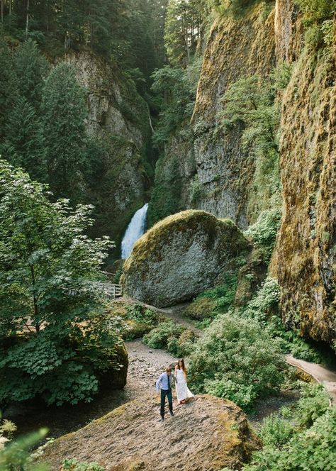 Couple walking on rock in a lush canyon in front of Wahclella Falls in Oregon. Intimate Forest Wedding, Multnomah Falls Oregon, Waterfall Wedding, Forest Waterfall, Lush Forest, Multnomah Falls, Intimate Wedding Ceremony, Groom Portraits, Oregon Wedding