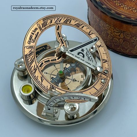 A Beautiful Sundial Compass, Perfect Gift for any occasion, Christmas, Birthday, Anniversary, Wedding Gift etc. Personalized engraving on the back makes it more unique and personal. You can have NAME, DATE, QUOTE, GPS COORDINATES, IMAGE or LOGO engraved on the back. Size of the compass is 4" approximately. Material of compass is brass. Finish : SILVER AND COOPER FINISH The compass and sundial are working pieces, compass shows you accurate direction and sundial helps you know the time in a fashio Engraved Compass, First Communion Gifts, Gps Coordinates, Communion Gifts, Silver Engraving, Baptism Gifts, Silver Work, Anniversary Wedding, First Communion