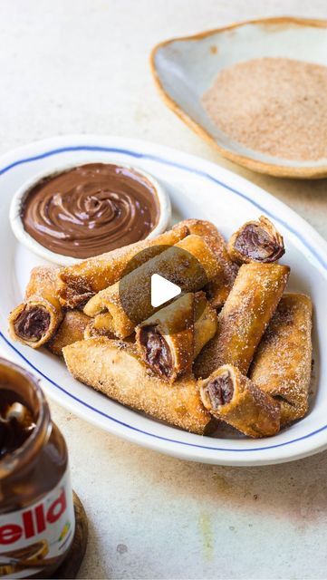 Shivesh Bhatia on Instagram: "Episode X #AtoZOfDesserts, a series where every letter unfolds a new delight 🥰 X for - Xangos💁🏻‍♂️ A delicious Mexican dessert, this fried tortilla cheesecake stuffed with creamy chocolate filling is perfect for when you are craving something sweet and crisp 🫶🏻  Ingredients: 🤌🏻1/2 cup cream cheese, softened  🤌🏻3 tbsp nutella 🤌🏻1 tbsp cocoa powder 🤌🏻2-3 tortillas 🤌🏻Cinnamon sugar (3 tbsp castor sugar + 1 tsp cinnamon powder)  🤌🏻Oil, for frying  Method   1.  Make the filling by taking softened cream cheese in a bowl and adding nutella and cocoa powder to it. Whisk it well so that everything is combined together and the filling is smooth and lump-free. Transfer this filling into a piping bag. 2. Next, take the tortilla and cut each tortilla into Soft Taco Shell Desserts, Easy Tortilla Dessert Recipes, Tortilla Ideas Snacks, Xangos Mexican Dessert, Tortilla Cheesecake, Desserts With Tortillas, Tortilla Nutella, Tortilla Dessert Recipes, Tortilla Cinnamon Rolls