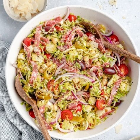 Italian Chopped Brussels Sprouts Salad | Ambitious Kitchen Italian Chopped Brussel Sprout Salad, Light Italian Dressing, Chopped Brussel Sprouts, Shredded Brussels Sprouts, Chopped Salad Recipe, Brussels Sprouts Salad, Chopped Salad Recipes, Italian Chopped Salad, Hearty Lunch