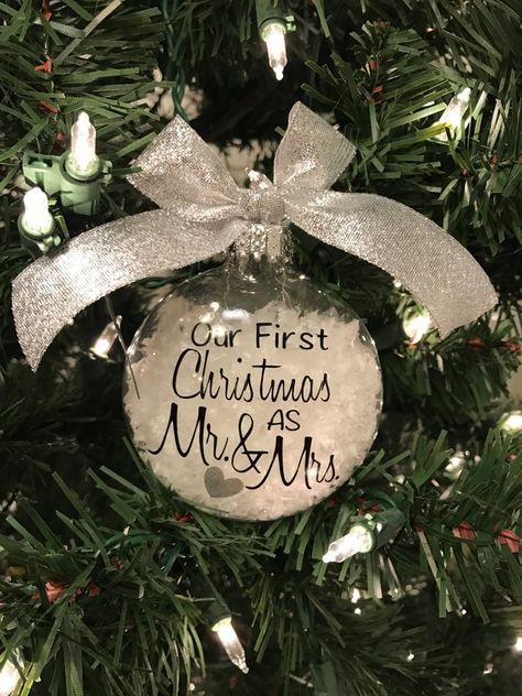 "Our First Christmas as Mr. & Mrs. Christmas Ornament with the year on the back. This ornament would look beautiful hanging on your Christmas Tree!  Ornament Details: --3.15\" Dome Glass Christmas Ornament --White \"snow\" --Black Vinyl Lettering --Silver Glitter Vinyl Heart --Black Year on Back (include in notes section) --Last Name can also be added to the back of ornament (include in notes section) --Silver Ribbon Looking for something a little different? Feel free to send me a custom order r Cricut Ornaments, Cricut Press, Christmas Husband, Wedding Christmas Ornaments, Wedding Ornaments, Our First Christmas Ornament, Christmas Gifts For Husband, Wedding Ornament, Our First Christmas