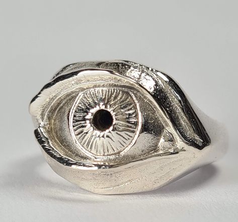 **Please note that we dispatch on Tuesdays unless special delivery express option is paid for** Sterling silver eye ring. Original design carved in wax then lost wax cast into solid sterling silver.  Available without a gemstone, with synthetic sapphire, synthetic emerald, garnet, black spinel, amethyst or any other gem by request. First class signed for post included for UK mainland orders. Wax Casted Rings, Wax Cast Ring, Wax Ring Carving, Lost Wax Ring, Wax Ring Carving Ideas, Strange Ring, Lost Wax Casting Rings, Silver Eye Ring, Wax Carved Ring