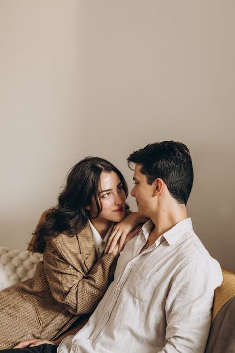 Couple Sitting Together · Free Stock Photo Couple Taking Photo Together, Close Couple Poses, Couple Poses On Couch, Couple Pose Sitting, Couple Standing Poses, Couple Poses Sitting, Couple Sitting Together, Romantic Poses, Couple Embracing