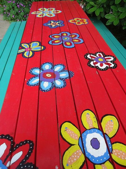 painting a unique picnic table, painted furniture, My flowers are brighter this year Painted Picnic Tables, Picnic Table Makeover, Whimsical Painted Furniture, Painted Patterns, Picnic Tables, Community Garden, Table Makeover, Painted Chairs, Funky Painted Furniture