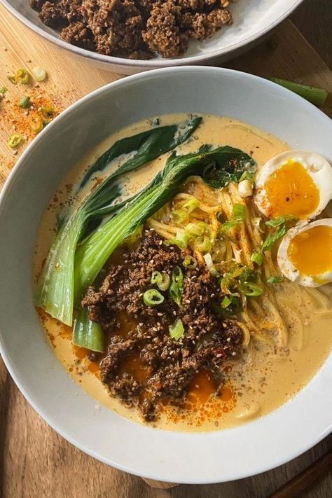 A serving of tantanmen ramen in a white bowl with ramen noodles topped with spicy minced meat, baby bok choy, one jammy ramen egg sliced in half, and garnished with green onions, sesame seeds and shichimi togarashi. On the side is another white bowl with more spicy minced meat. Asian Noodle Recipes Easy, Simple Ramen Recipes, Home Made Ramen Noodles, Creamy Ramen Recipe, Tantanmen Ramen Recipe, Tantan Ramen, Tantanmen Ramen, Creamy Ramen, Easy Asian Noodle Recipes