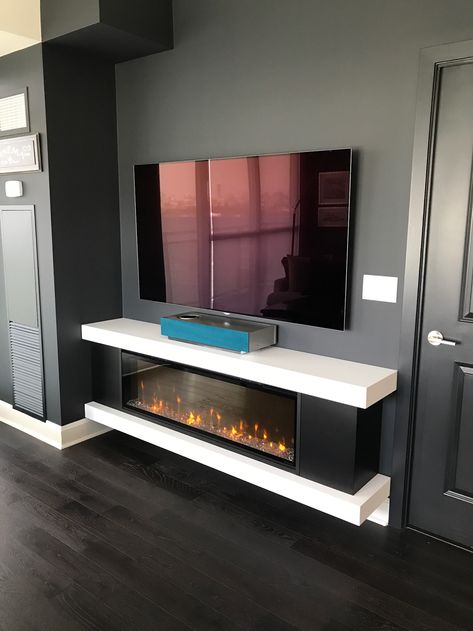 Custom Cabinet with a regular Electric Fireplace. Private Residence Toronto. Fireplace with TV above. Concealed Television, Tv Camino, Tv Walls, Tv Fal, Tv Mounting, Fire Design, Tv Stand Designs, Mounted Fireplace, Fireplace Tv Wall