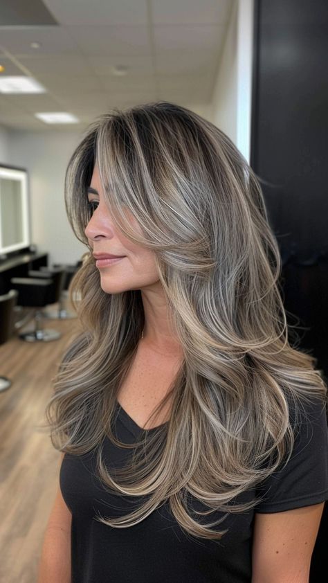 23 Stunning Gray Hairstyles for Older Women Who Radiate Confidence Hairstyle For Women Over 40 Long, Dark Blonde Grey Blending, Blonde Hair For Older Women Over 50 Long Hairstyles, Layered Ash Brown Hair, Ash Blonde Layered Hair, Long Layered Grey Hair, Blended Gray Hair With Highlights, Grey Hair In Your 30's, Long Hair For Women In Their 40s