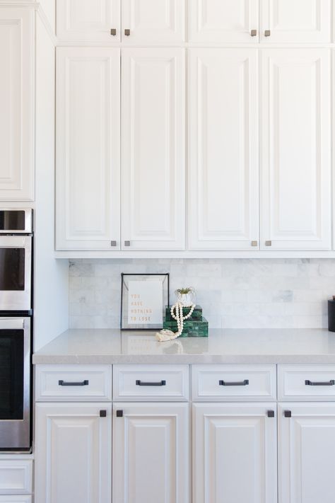 Details, details, details! These classic white kitchen cabinets are subtly accented by beautiful square-shaped metal handles and knobs. What do you think? Kitchen Cabinets Knobs And Pulls, Classic White Kitchen, Kitchen Cabinet Knobs, White Kitchen Cabinets, Kitchen Handles, Cabinet Knobs, White Kitchen, Knobs And Pulls, New Kitchen