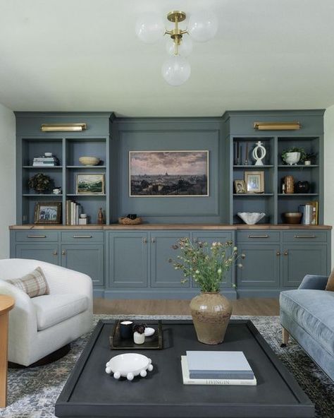 Jean Stoffer on Instagram: "The Living Room at our brick ranch project got a major upgrade with this wall of cabinetry from our Townhouse Collection @stofferhomecabinetry in elegant Camden Grey. Check this line out if you have a more moderate budget. Same excellent quality and design, just limited choices, bells and whistles. And if you want to see the whole project check out Episode 4 of The Established Home! Streaming on Max and Discovery+. ❤️" Living Room Built In Cabinets, Painted Built Ins, Stoffer Home, Built In Wall Units, Jean Stoffer, Family Lounge, Built In Entertainment Center, Built In Shelves Living Room, Living Room Built Ins