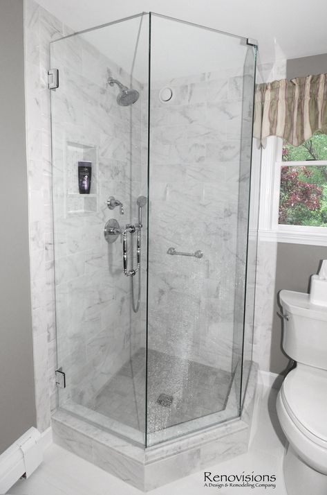 A completed full bathroom remodel by Renovisions. Neo-angle corner shower, glass shower door, transitional design, porcelain tile, large format tile, shower cubby, walk-in shower, hand-held shower, quartz countertop, green painted cabinetry. Shower Cubby, Glass Corner Shower, Small Shower Stalls, Corner Shower Stalls, Neo Angle Shower, Small Bathroom Layout, Small Bathroom With Shower, Full Bathroom Remodel, Glass Shower Door