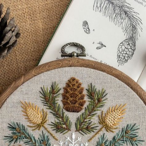 Tamara Carlier | Modern hand embroidery patterns | Etsy shop on Instagram: "🪡🌲❄️ Today marks one year since I released this winter sampler embroidery pattern. It’s been my best seller since day 1 – but so much more than that...  Up until that point, I was just about hanging on by a thread, dipping into my savings each month and running on a diminishing amount of self-belief. I was enormously grateful for the sales I’d had since starting The Hoop in Hand the year before, but I wasn’t really making a living, and I was starting to think I’d have to give up on my dreams 😞  I remember test-stitching the pine cones for this pattern in my back garden on one of those unseasonably hot days you occasionally get towards the end of summer. I was chatting to my next-door neighbour over the fence, an Yule Embroidery Pattern, Pine Embroidery, Pine Cone Embroidery, Sampler Embroidery, Hanging On By A Thread, Modern Hand Embroidery Patterns, Modern Hand Embroidery, Winter Embroidery, Embroidery Border