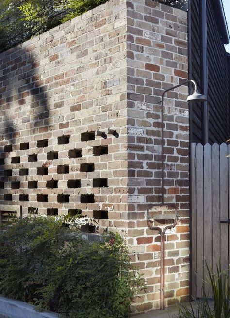 Part of the house, including a corner with an outdoor rinsing shower, is made of brick reclaimed from building demolitions throughout Australia. Queenslander Renovation, Derelict House, Outdoor Makeover, Recycled Brick, Brick Garden, Australian Landscape, Specimen Trees, Patio Roof, Family Garden