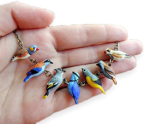 Ukraine's Darya Tarasenko (SoFoxyClay) delights us with her sculpted polymer birds on a wire. What a great gift for a birder. And perfect for a summer Friday. You can get to know Darya best on Pinterest. Then keep going on Facebook, Instagram, [...] Polymer Clay Kunst, Cute Beads, Bird Sculptures, Jewelry Clay, Bird Flying, ดินปั้น Polymer Clay, Beads Ideas, Colorful Necklace, Tanah Liat