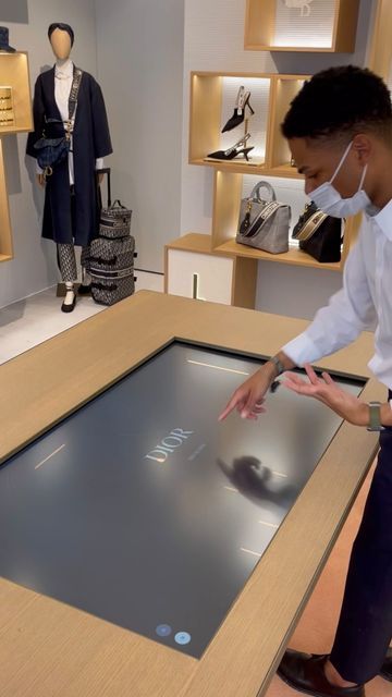 Rettech | Retail Tech Experiences on Instagram: "Inside ABC @dior , SoHo (NYC) where clients can: - Browse a collection of bags through a table touch screen - Personalize their bag’s pattern - Add initials and emojis - See how the bag looks like in 3D - Scan a QR code to save their custom bag for later - Receive the link in their email and share it with friends. Get inspired!💎 #tech #retail #retailtech #digitalexperience #abcdior #abcdiorpopup #diornyc #luxurytech #digitalluxury #newretail # Touch Screen Table, Fragrance Display, Digital Retail, Soho Nyc, Retail Experience, Store Ideas, Touch Screen Display, Clothing Retail, Large Table