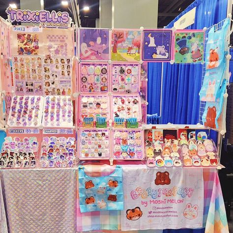 We are here at #floridasupercon at table 1448 with @marinaxstudios and @tokki_sprout 💖 come say hi and buy some cute goodies! #supercon #kpop #danmei #artistalley #pastelaesthetic #kawaiiaesthetic Artist Alley Table Display, Vending Display, Vendor Table Display, Alley Ideas, Art Festival Booth, Craft Displays, Vendor Table, Festival Booth, Sticker Business