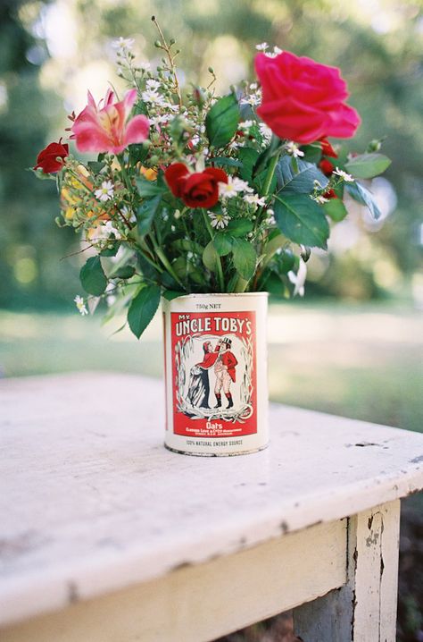 Instead of the current pic on the can, make it from an old sideshow ad like conjoined twins or the Fiji Mermaid. Something whimsical and macabre. Tin Can Wedding Ideas, Circus Wedding Theme, Vintage Carnival Wedding, Wedding Postcards, Inexpensive Wedding Flowers, Red Centerpieces, Circus Wedding, Orange Wedding Flowers, Simple Wedding Flowers