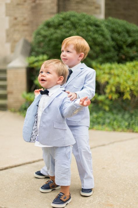 The ring bearer was the couple’s nephew. He wore a seersucker suit, blue tie and navy boat shoes. “It was the cutest thing ever!” says Amber. Suit And Bow Tie, White Tuxedo Wedding, Boys Formal Wear, Boys Tuxedo, Seersucker Suit, Bearer Outfit, Ring Bearer Outfit, Prom Suits, Toddler Boy Shoes