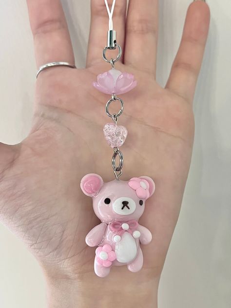 Sakura Rilakkuma Keychain - handmade with polymer clay and painted with acrylic paint - coated with uv resin - comes with a phone strap - please handle with care❤️ Air Dry Keychain, Polymer Clay Pen Holder, Polymer Clay Cute Charms, Polymer Clay Trinkets, Polymer Clay Charm Ideas, Sakura Rilakkuma, Cute Clay Keychains, Diy Clay Keychain, Polymer Clay Aesthetic