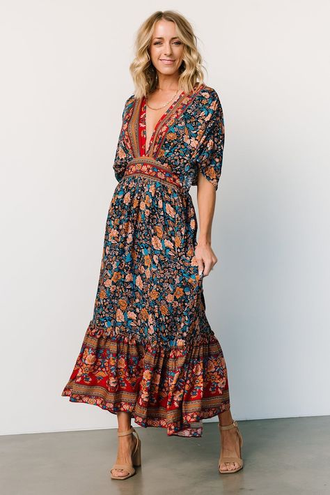 Baltic Born exclusive style Navy with rust, peach, teal, and red accents Boho border floral print throughout Easy-to-wear, lightweight material Surplice neckline Gathered detailing at bodice Short, flowy sleeves with ruching Keyhole closure at back neck High waistline with smocking at back Functional side pockets Flowing midi-length skirt 100% Rayon Sierra is 5’8, cup size 37”, size 6/8 and wearing size L Trina is 5'6, cup size 32D, size 2 and is wearing size S Hipster Outfits For Women, Boho Border, Midi Dress Navy, Baltic Born, Velvet Maxi Dress, Velvet Maxi, Flowy Sleeves, Hipster Outfits, Surplice Neckline