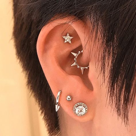 I like the idea of this spiked daith jewelry, although it's not as simple as what I'd imagine for myself. Would opt for more simple jewelry on lobes/cartilage. Daith Piercing Aesthetic, Heavily Pierced Ears, Piercing Curation, Ear Project, Ear Curation, Ear Peircings, Opal Belly Ring, Spike Ring, Daith Jewelry