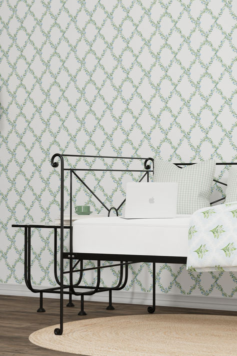 An iron daybed and iron table in a green and white wallpapered room. Iron Daybed, Brass Beds, Pop Up Trundle, Gorgeous Bed, Feather Bed, Brass Bed, Daybed With Trundle, Old Mattress, Master Bedding