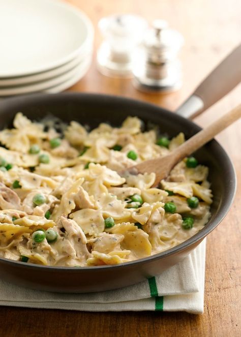 Rely on rotisserie chicken to get this creamy pasta skillet on the table pronto! Substitute cubed cooked ham in place of the chicken, if you prefer. Bow Tie Pasta Recipes, Pasta Recipes With Chicken, Chicken And Peas, Bow Tie Pasta Recipe, Rotisserie Chicken Recipes Leftover, Pea Pasta, Bow Tie Pasta, Noodle Casserole Recipes, Recipes With Chicken