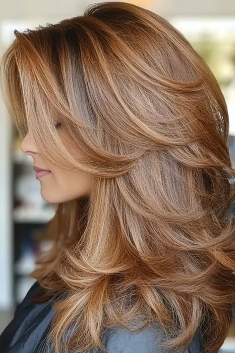 Woman with layered, voluminous, golden-brown hair looking to the side. Hair Color Honey, Bold Highlights, Brunette Tones, Balayage Hairstyle, Golden Brown Hair Color, Natural Brown Hair, Balayage Ideas, Rambut Brunette, Golden Brown Hair