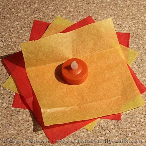 How to Build a Campfire – About Family Crafts Fire Out Of Tissue Paper, Fake Campfire Diy Tissue Paper, Tea Light Campfire, Diy Camp Fire Craft, Diy Fire Craft, Tissue Paper Campfire, How To Make Fake Fire With Tissue Paper, Scouting Centerpieces, Diy Camping Decorations Party Ideas